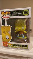 Front view of Zombie Bart Funko Pop in original boxed packaging, showing figure design and box details including number 1027 and branding.