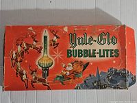 Photo of the original Yule-Glo Bubble Lites box featuring the product name and festive Christmas graphics