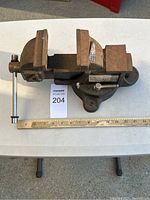 Full view of the 6-inch Duracraft bench vice showing jaws, handle, base, and mounting holes.