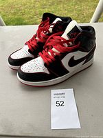 Front angle of both shoes showing colorway, laces and overall condition