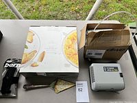 Full lot overview showing all items on a table outdoors.