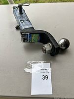 Side image of the trailer hitch showing the ball mount and attaching pin.