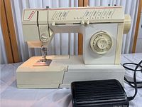 Front and side view of Singer 5805C sewing machine showing stitch pattern selections and stitch setting dial.