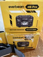 Two yellow and black Everbeam H6 Pro headlamp boxes stacked with one adjustable strap partially visible.