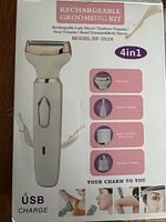 Box front showing product image, model RF-3028, and 4 in 1 functions: lady shaver, eyebrow trimmer, nose trimmer, beard/body shaver. USB chargeable.