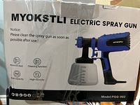 Box of MYOKSTLI electric spray gun showing branding, model PQQ-002, and feature icons for cleaning function, dust removal, high capacity container, high viscosity spray.