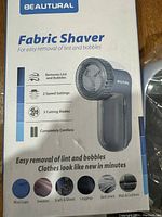 Box displaying Beautural Fabric Shaver features and uses
