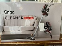 Box front showing assembled vacuum cleaner and handheld configuration images.