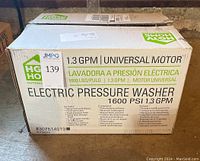 Box of HGTV Home Outdoor Living Electric Pressure Washer displaying key features such as 1600 PSI, 1.3 GPM, universal motor.