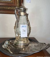 Vintage Sheridan silver plated coffee carafe with clear ribbed glass and ornate holder with warmer base. Accompanied by silver plated serving tray and spoons, crumb pan.