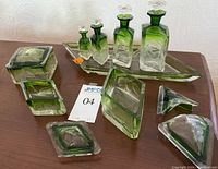 Overview of all pieces on table including bottles, stoppers, boxes and tray