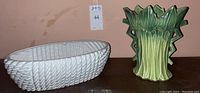 Photo showing both the white textured bowl and the green leafy McCoy vase side by side