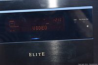 Close-up of front LED display showing input mode and volume level