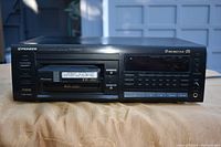 Front and top view of the Pioneer multi-disc CD player showing the dual disc trays, buttons, and display