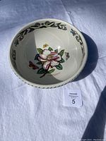 Top view of ceramic salad bowl showing magnolia flower and floral border inside