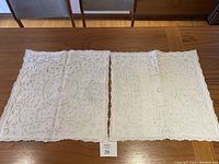 Two vintage pillowcases side by side showing lacework and embroidery on one pair