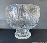 Full clear glass bowl showing rippled ice texture on outside surface and footed base.