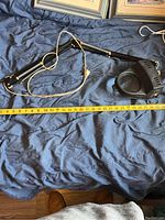 Full view of lighted magnifying glass with adjustable arm and power cord showing length and condition.