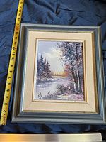 Full view of the framed canvas painting with a measuring tape showing height approximately 15 inches.