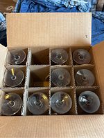 Top view showing 10 wine glasses packed in a cardboard box with dividers.