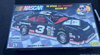 Front box image showing the complete unopened NASCAR Dale Earnhardt LEGO car model set with branding, piece count, and recommended age 7+.