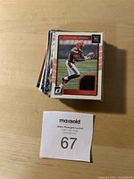 Stacked football cards with a visible Cleveland Browns player's card on top.