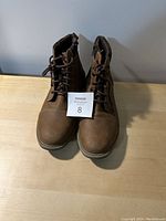 Front view of brown men's size 13 fashion dress boots with laces and side zippers, showing excellent condition.