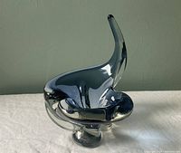 Front angled view of dark blue Chalet glass bowl showing sculptural form and signed base.