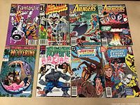 Image shows eight comic books laid out in two rows of four, featuring classic Marvel and DC titles with bright and detailed cover art.