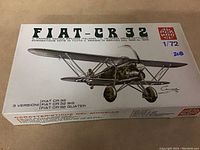 Top view of unopened Fiat CR 32 1/72 aircraft model kit box showing vintage Italeri branding and aircraft illustration.
