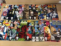 Photo of 20 Punisher comics laid out showing various cover designs and issues in the lot