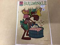 Front cover of Bullwinkle #1 comic book featuring vintage illustration of Bullwinkle character washing clothes in a tub. Shows price 15 cents and Dell Comics branding.