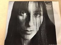Front cover of Cher vinyl LP album Gypsys, Tramps & Thieves showing black and white close-up portrait of Cher