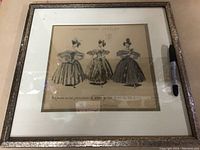 Full view of the framed fashion plate showing three women in 1834 dresses labeled 'Collection Geszler'.