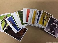 Pile of 97 Fortnite trading cards spread out, showing variety of character images and card backs.