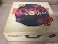 Sealed Rock-It trivia game vintage board game box with vinyl record design on lid.