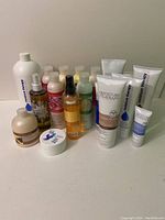 Overview of assorted skincare bottles, jars, and tubes in different shapes and sizes.