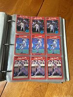 Photo of a binder page with 9 Fleer baseball cards: Rick Sutcliffe, Dave Stieb, Lloyd Moseby