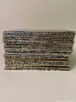 Stack of 12 used Little Golden Books showing golden spines with titles and wear consistent with used condition.