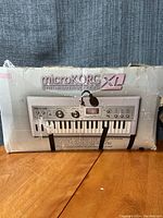 Closed retail box of microKORG XL with front artwork and branding
