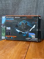 Box front showing Sharper Image V800 Video Streaming Drone image and branding