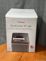 Front view of the Vitamix FoodCycler FC-50 box showing the product and branding.