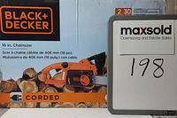 Photo of the Black+Decker chainsaw boxed packaging with brand and product details visible