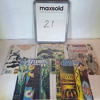 Five comic books laid out in one row showing all covers including Armageddon Alien Agenda, Sovereign Seven, Hardware, and two Arion The Immortal comics.