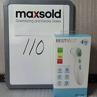 Front view of box displaying BestMed infrared forehead thermometer with color backlight and quick 1 second reading features.
