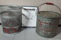 Photo of the minnow bucket and the wire mesh minnow trap side by side with lot number card.