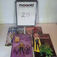 Photo of four 1987 independent comics including Pigments #1, two copies of The Final Cycle Part 1, and Tro Lord Lessons #1.