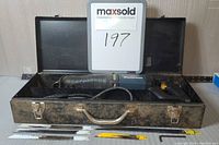 Mastercraft reciprocating saw inside a metal carrying case with blades laid out inside case.