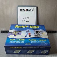 Blue box for Reddi-Rink E-Z Freeze Ice Rink Kit with label and size information, taken from front