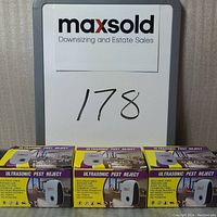 Three boxed Ultrasonic Pest Reject devices arranged side by side with visible front packaging and product design.